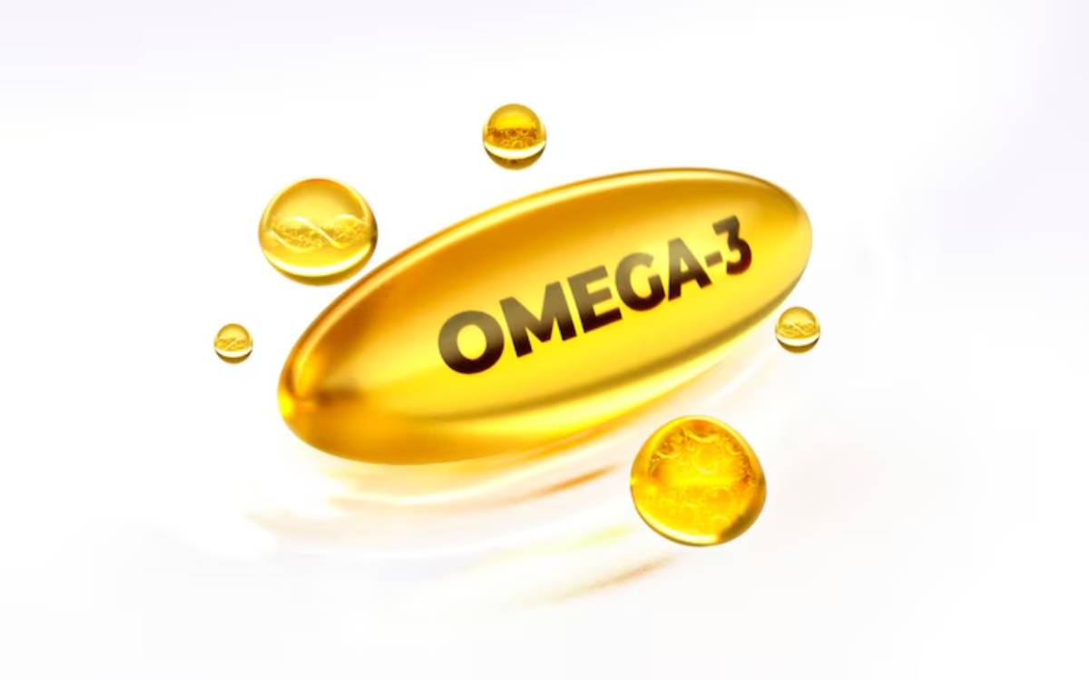 A shining golden Omega-3 capsule surrounded by smaller golden oil droplets on a light background, emphasizing health benefits.